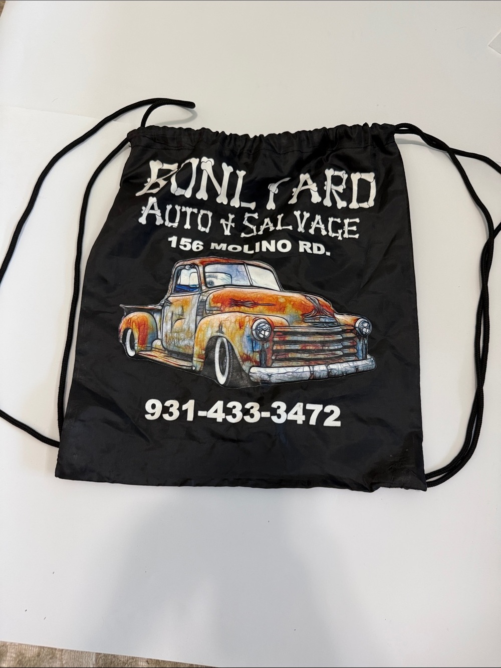 Port Authority Black Drawstring Backpack with Orange Vintage Truck Graphic